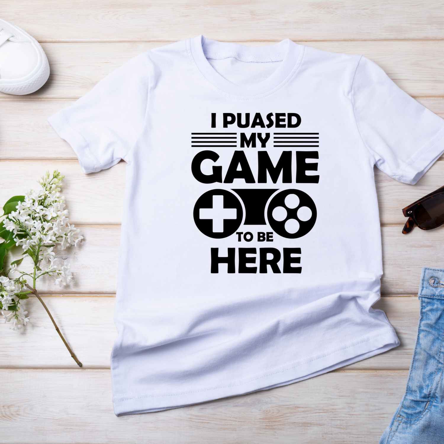 "Pause no more! 'I Paused My Game to Be Here' t-shirt design awaits. Get ready to level up your style. Go grab it now!"